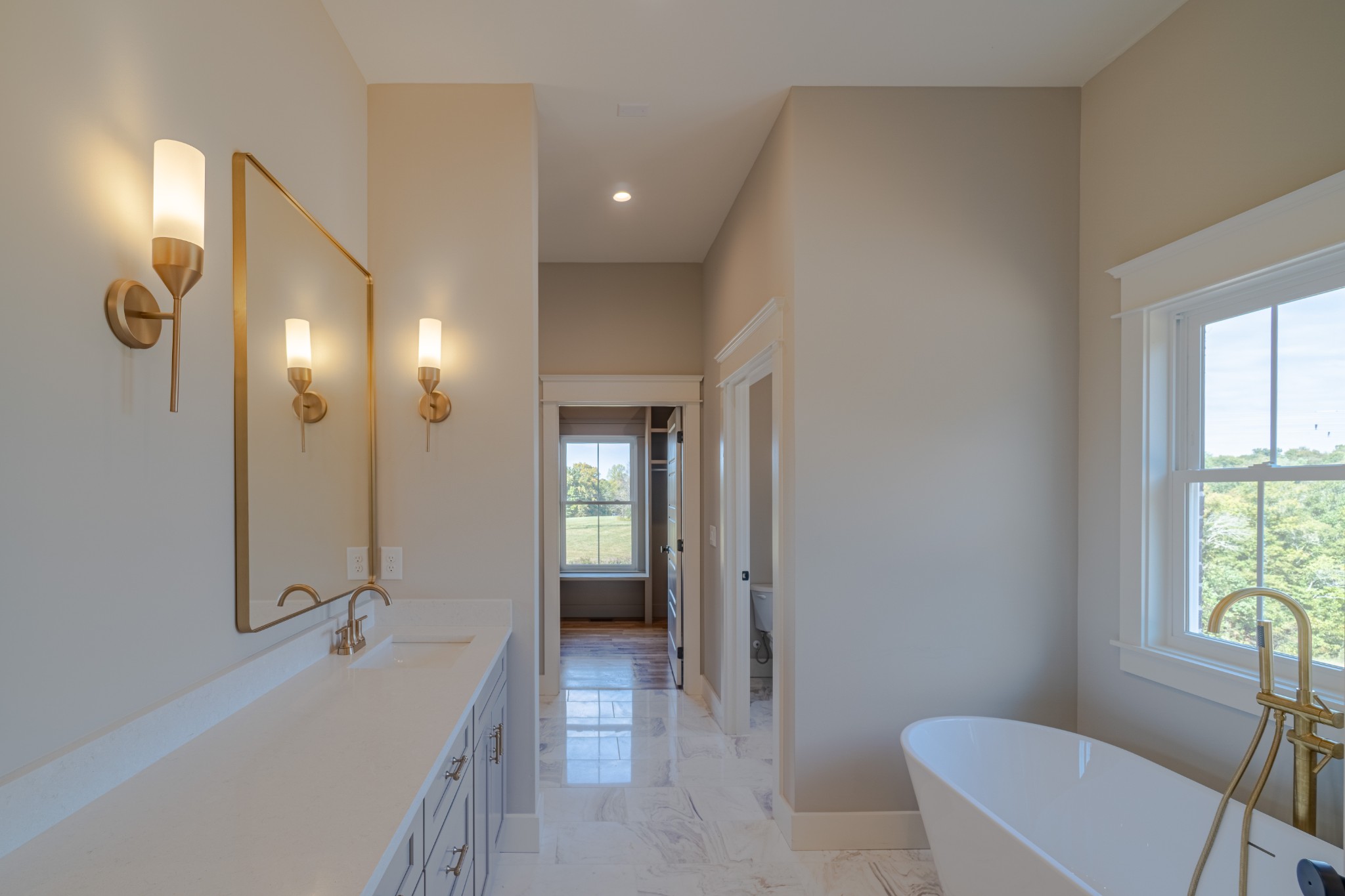 7039 Hall Road Greenbrier, TN 37073 - Photo 27 of 73 a bathroom with a tub a toilet and a sink