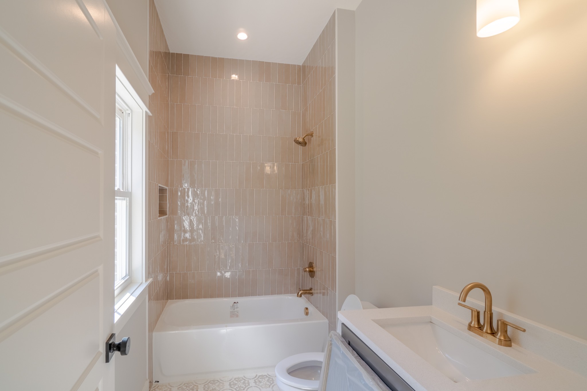 7039 Hall Road Greenbrier, TN 37073 - Photo 37 of 73 a bathroom with a granite countertop sink a toilet and shower