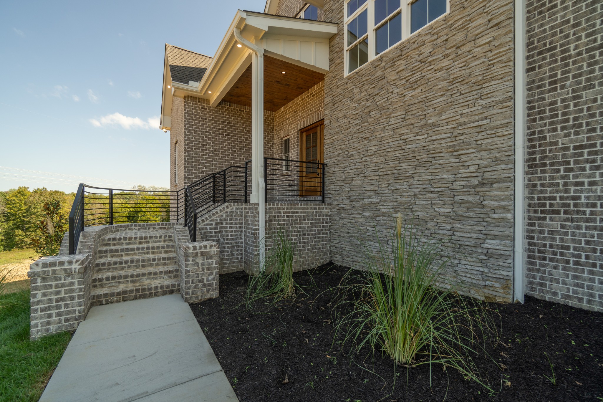 7039 Hall Road Greenbrier, TN 37073 - Photo 6 of 73 a view of a pathway both side of building
