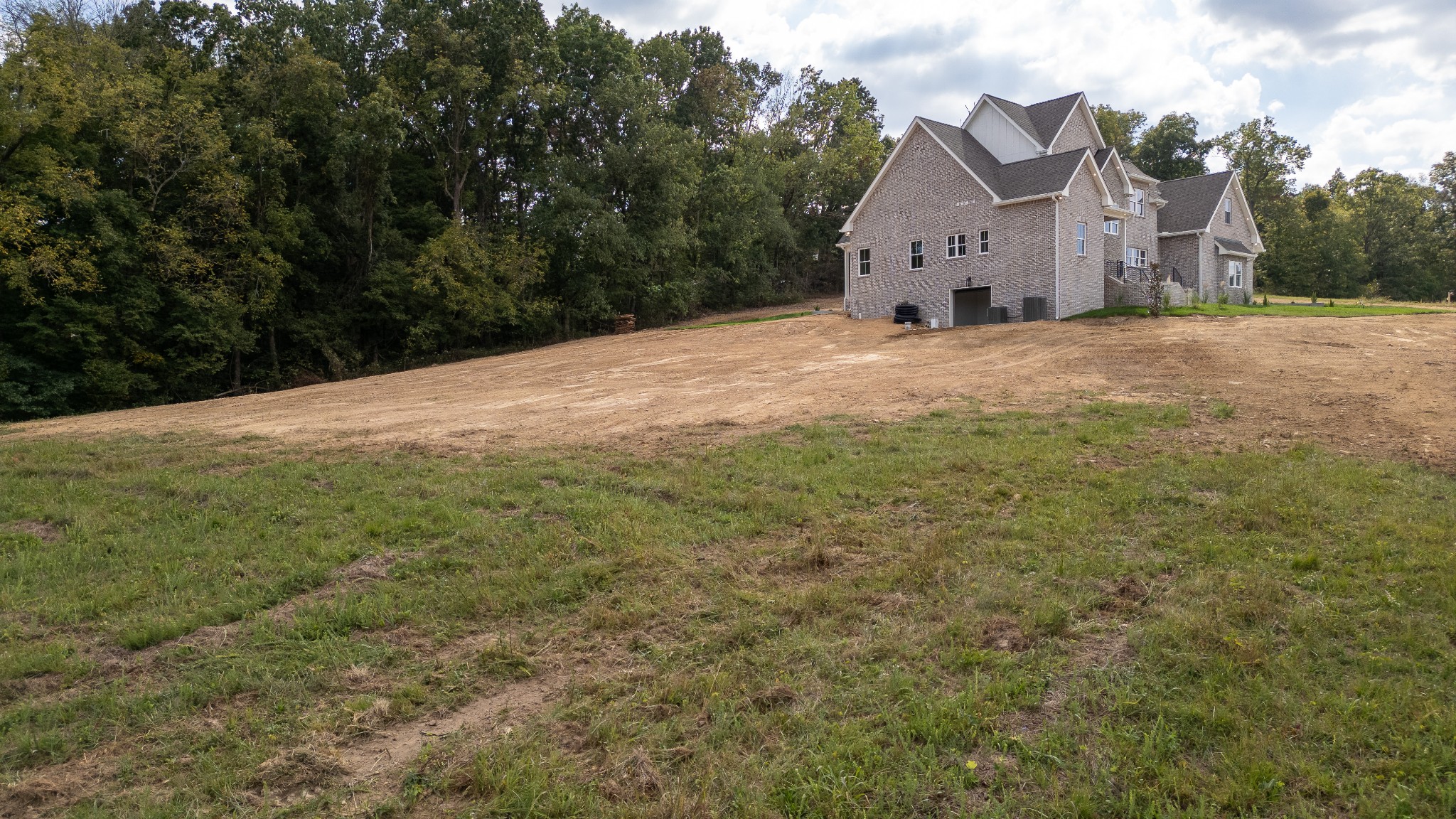 7039 Hall Road Greenbrier, TN 37073 - Photo 72 of 73 a view of a big house with a big yard and large trees