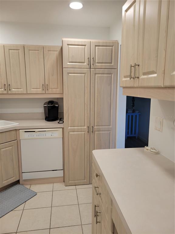 220 Santa Maria Street, Unit 442 Venice, FL 34285 - Photo 13 of 27 a kitchen with white cabinets and white appliances