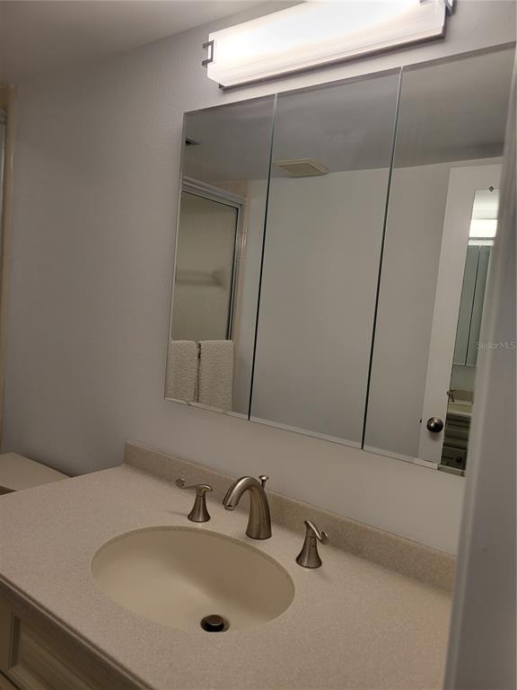 220 Santa Maria Street, Unit 442 Venice, FL 34285 - Photo 24 of 27 a bathroom with a sink and mirror