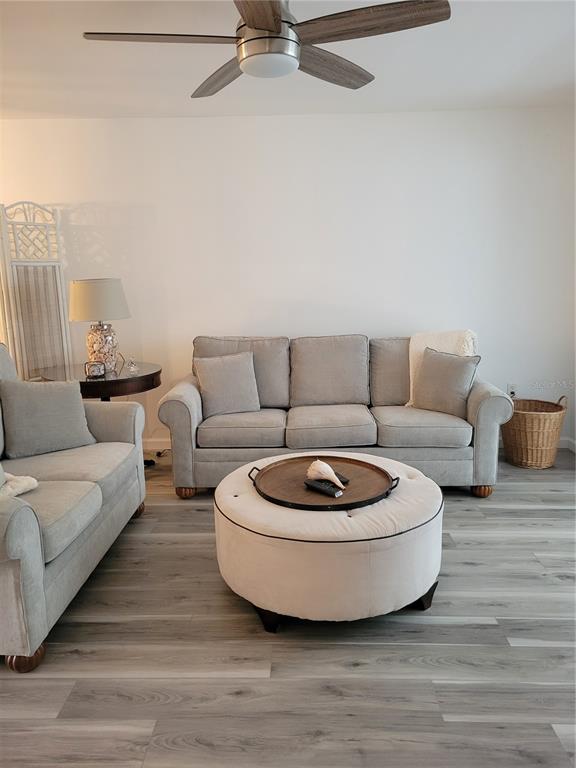 220 Santa Maria Street, Unit 442 Venice, FL 34285 - Photo 5 of 27 a living room with furniture and a couch