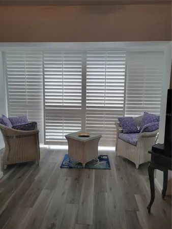 a view of a patio with couple of white walls