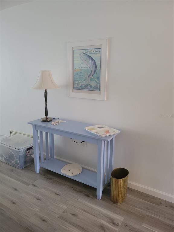 220 Santa Maria Street, Unit 442 Venice, FL 34285 - Photo 9 of 27 a view of entryway with wooden floor