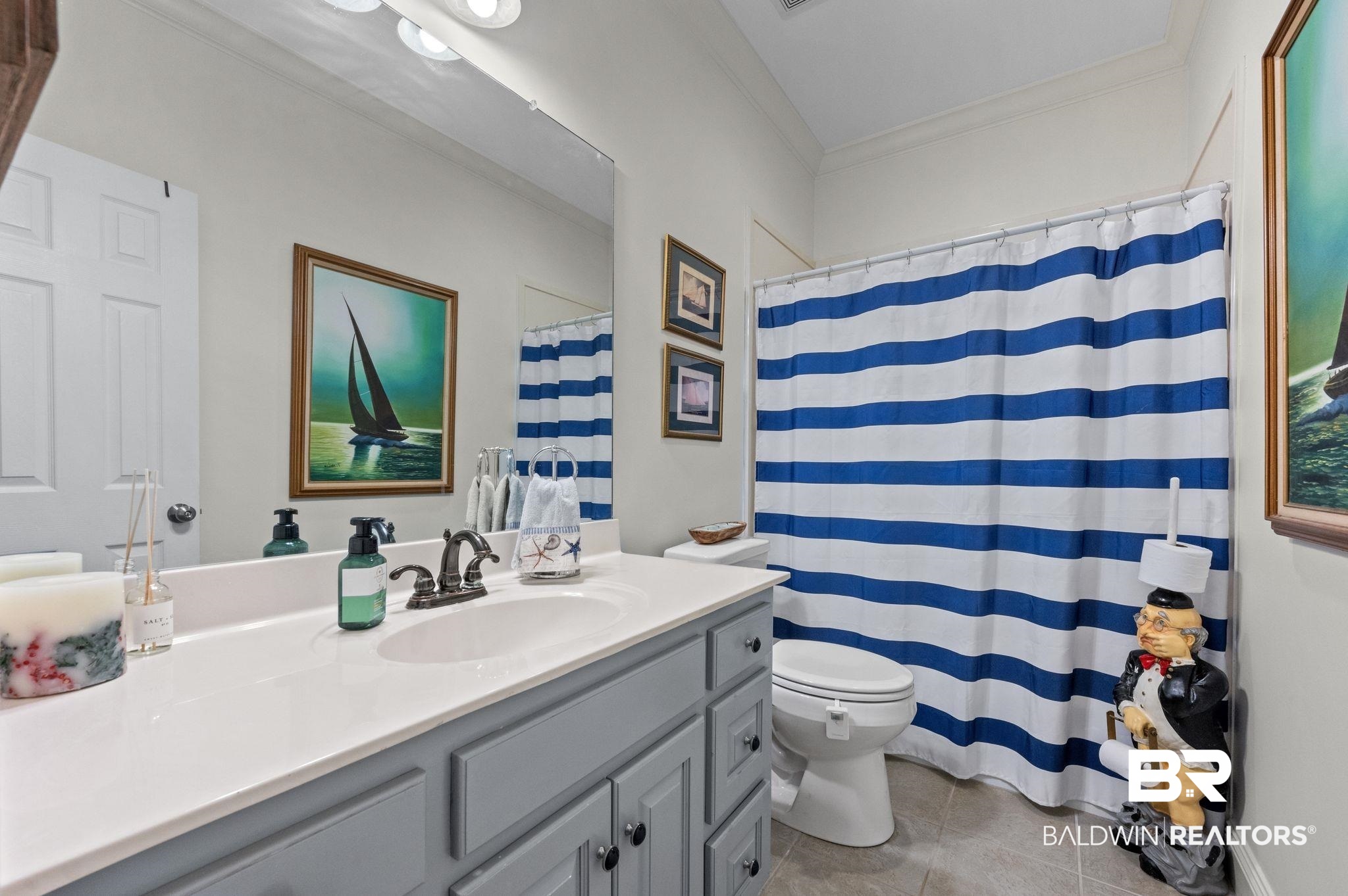30151 Dolive Ridge Daphne, AL 36527 - Photo 22 of 37 Full bathroom featuring toilet, ornamental molding, curtained shower, tile patterned flooring, and vanity