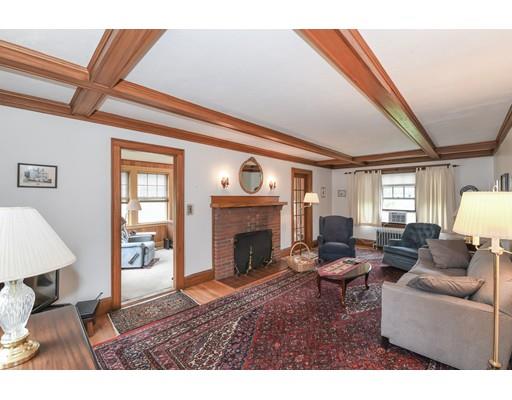 161 Lovell Road Watertown, MA 02472 - Photo 3 of 15 a living room with furniture a fireplace and a table