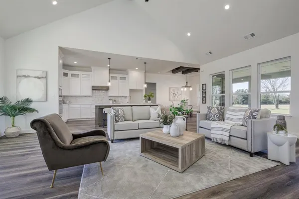 a living room with furniture and a large window