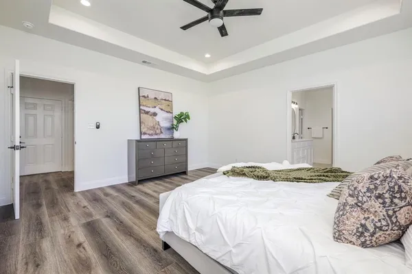 a bedroom with a bed and a dresser