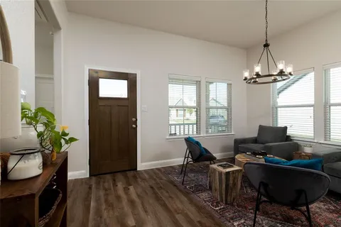 a workspace with furniture window and wooden floor