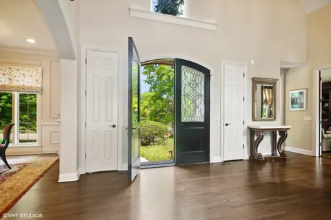 a view of a livingroom with furniture window and wooden floor