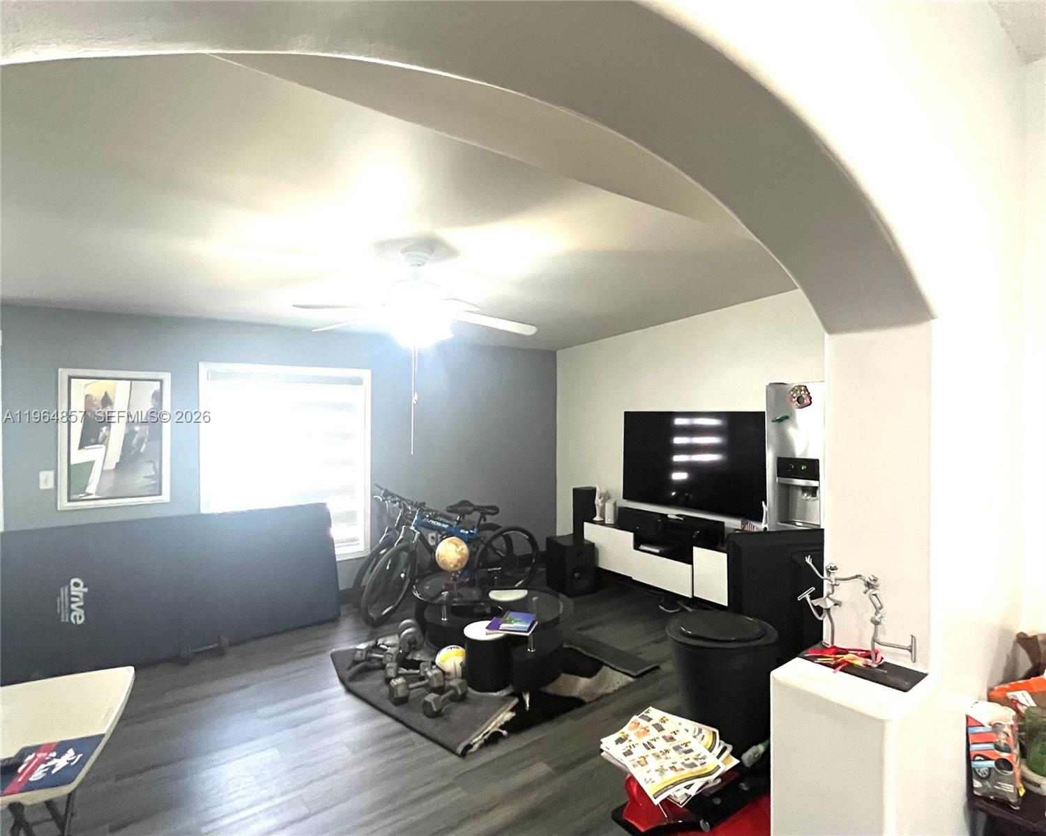 12271 Southwest 187th Street Miami, FL 33177 - Photo 13 of 27 a living room with furniture and a flat screen tv