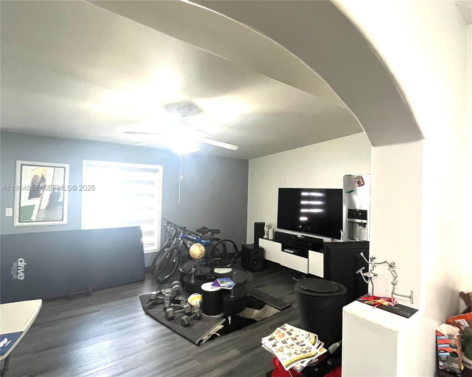 12271 Southwest 187th Street Miami, FL 33177 - Photo 14 of 27 a living room with furniture and a flat screen tv