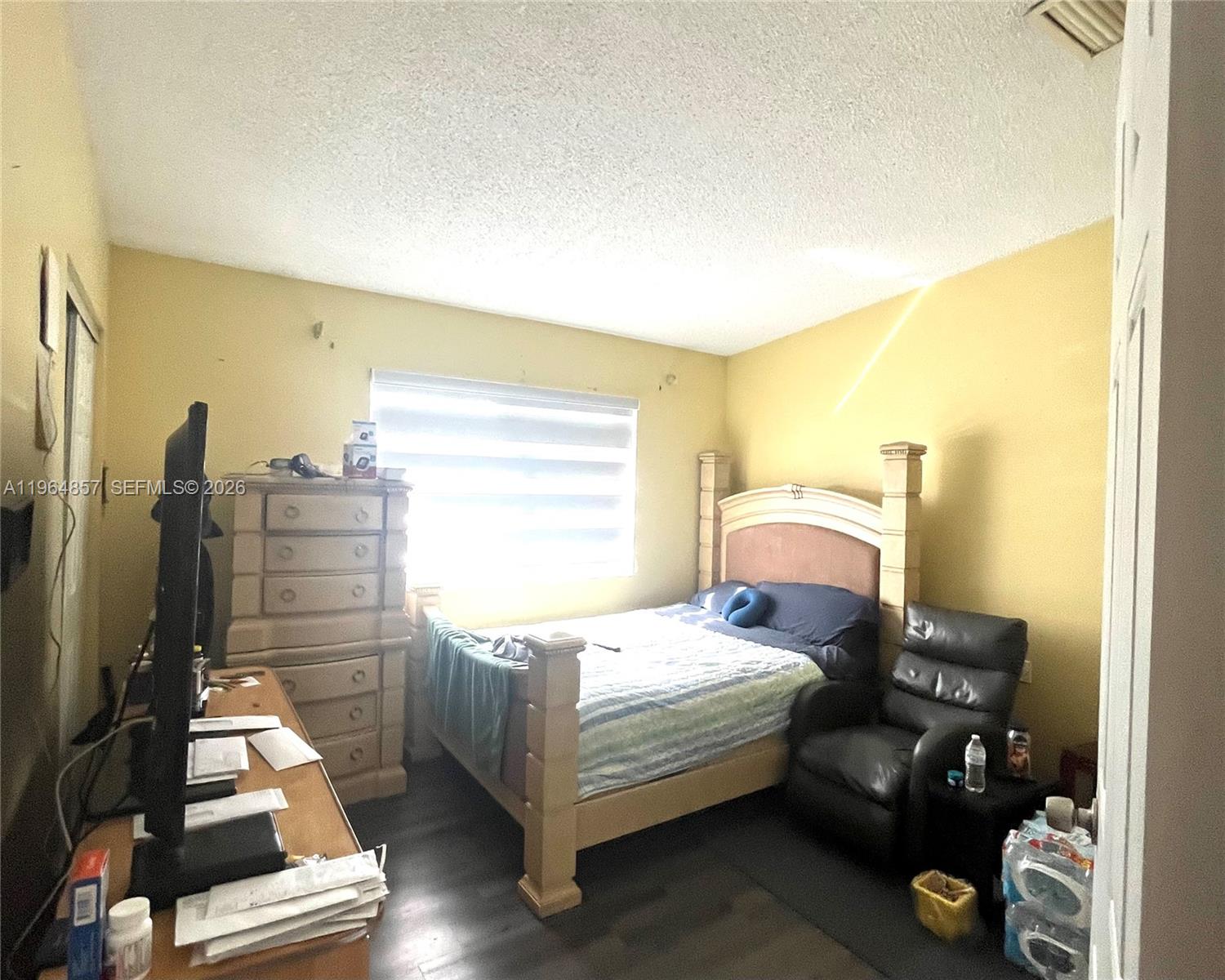 12271 Southwest 187th Street Miami, FL 33177 - Photo 7 of 27 a bedroom with a bed and wooden floor