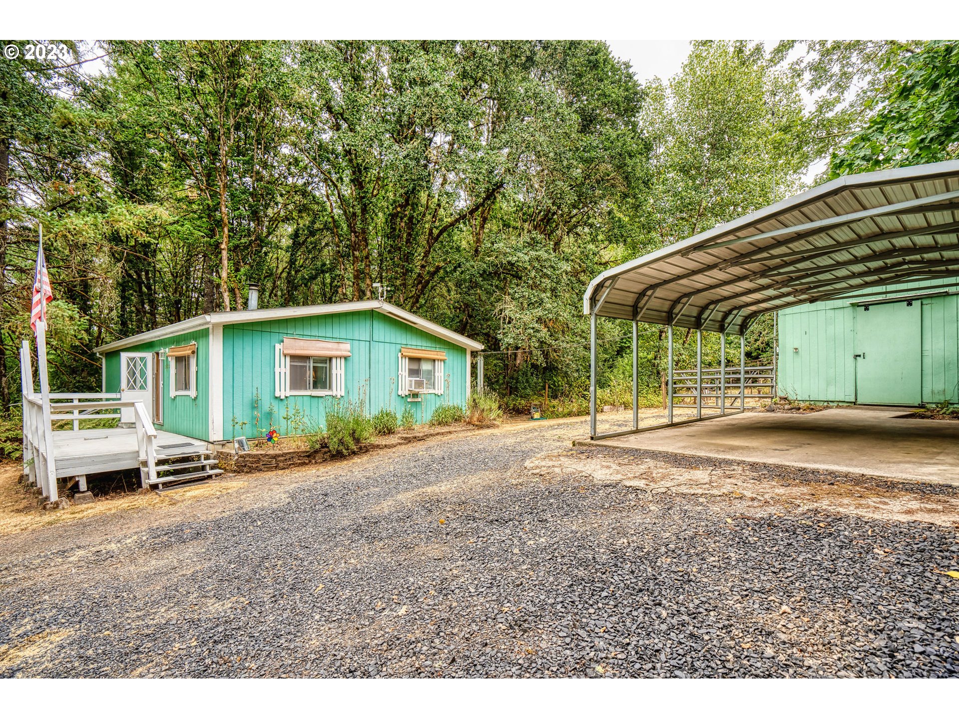 26720 Northwest Williams Canyon Road Gaston, OR 97119 - Photo 1 of 33 a front view of a house with a garden