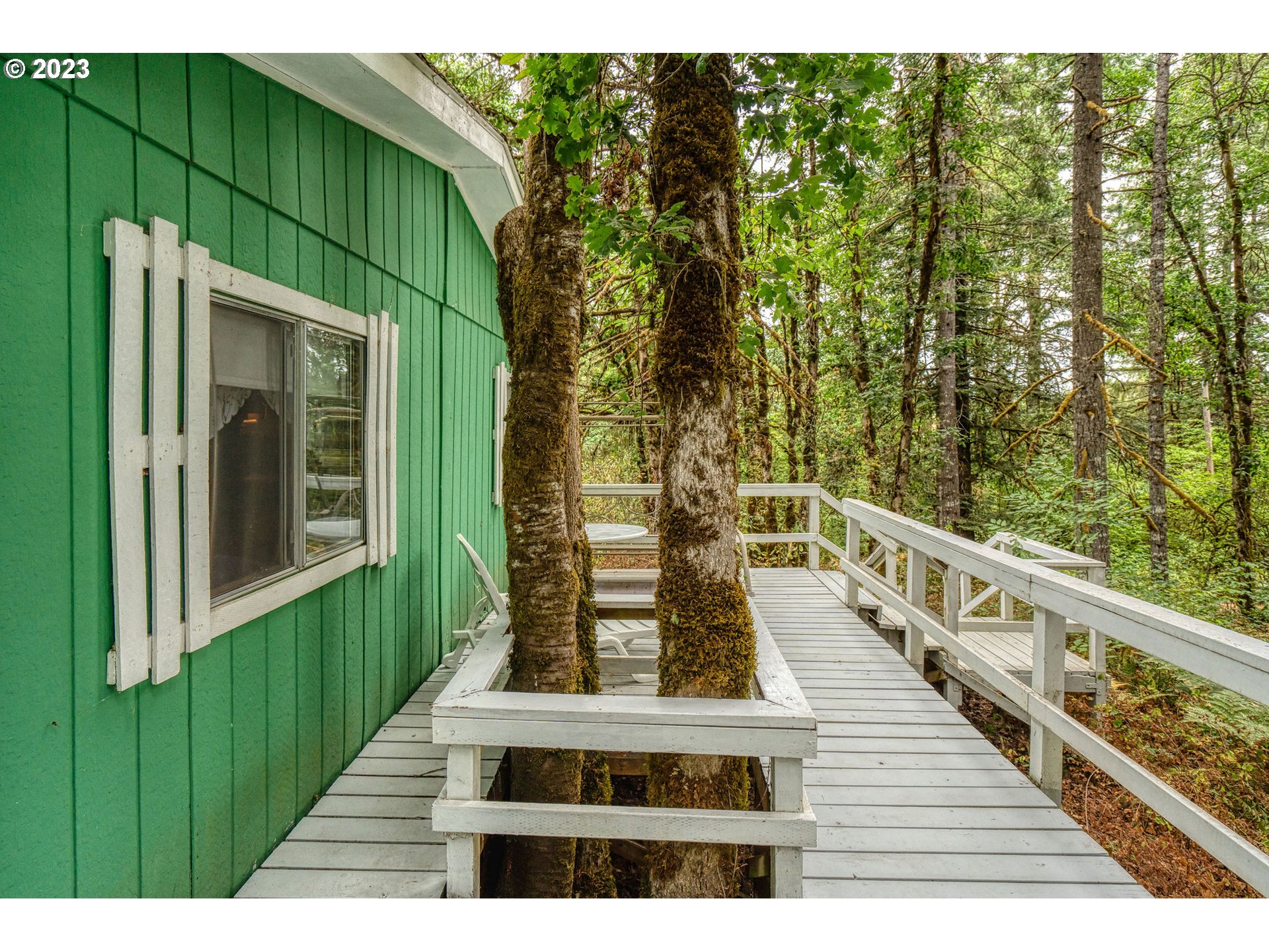 26720 Northwest Williams Canyon Road Gaston, OR 97119 - Photo 12 of 33 a view of a balcony with wooden floor and fence