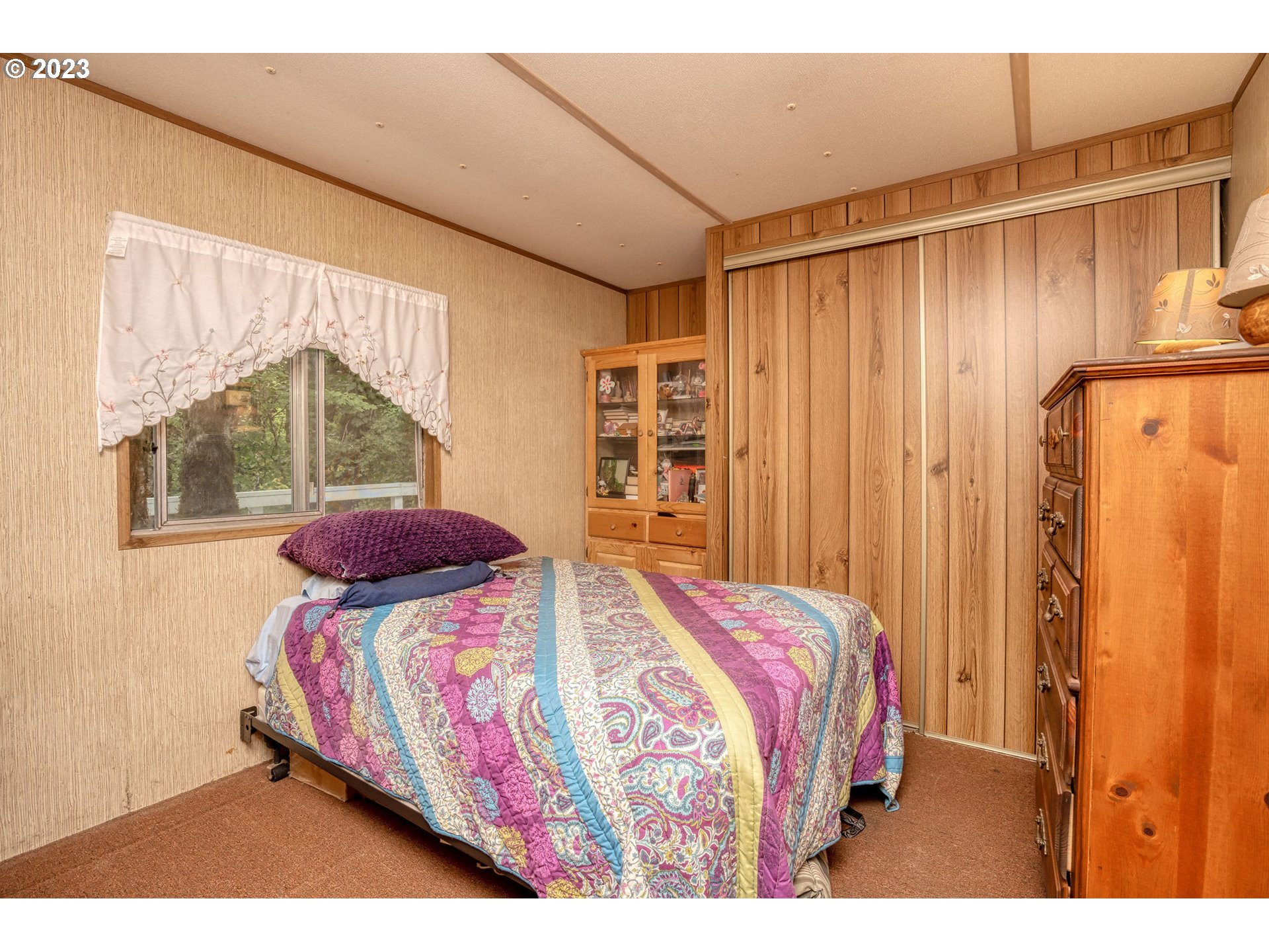 26720 Northwest Williams Canyon Road Gaston, OR 97119 - Photo 29 of 33 a bedroom with a bed and a large window