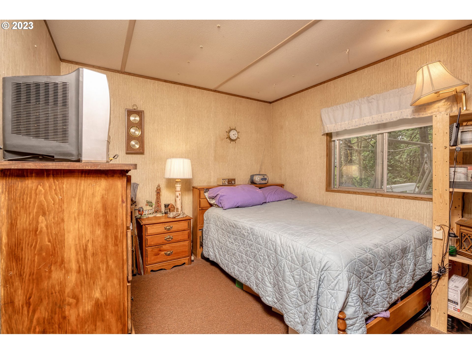 26720 Northwest Williams Canyon Road Gaston, OR 97119 - Photo 30 of 33 a bedroom with a bed and wooden floor