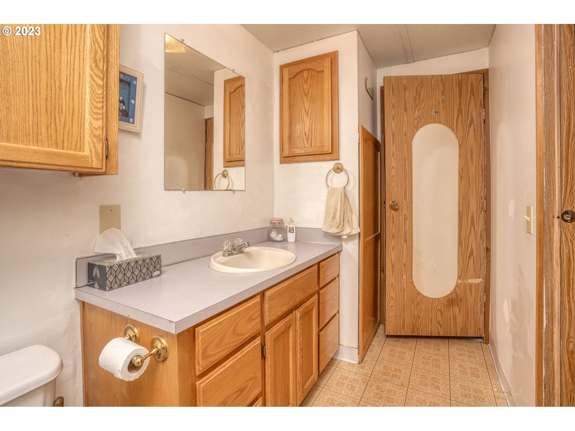 26720 Northwest Williams Canyon Road Gaston, OR 97119 - Photo 33 of 33 a bathroom with a granite countertop sink and a mirror