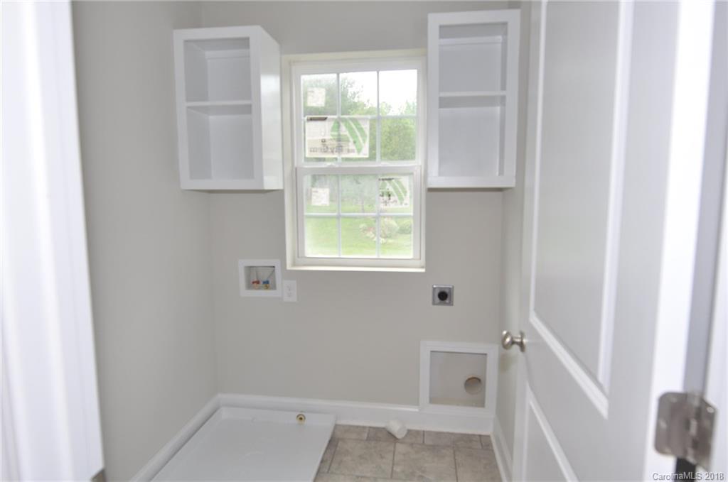 4081 Ruston Creek Road, Unit 83 Catawba, SC 29704 - Photo 14 of 27 a small space with white cabinets and a window