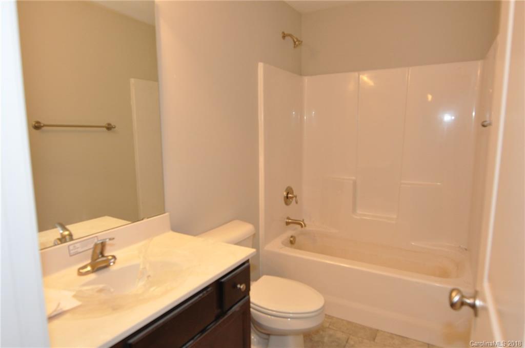 4081 Ruston Creek Road, Unit 83 Catawba, SC 29704 - Photo 15 of 27 a bathroom with a sink a toilet and shower