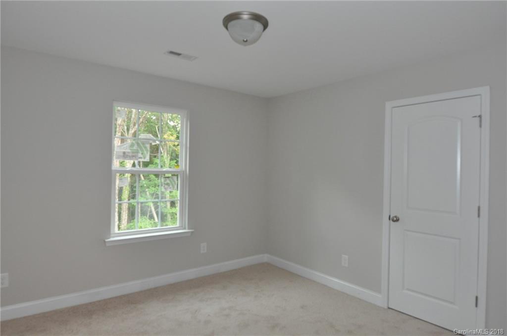 4081 Ruston Creek Road, Unit 83 Catawba, SC 29704 - Photo 18 of 27 an empty room with windows