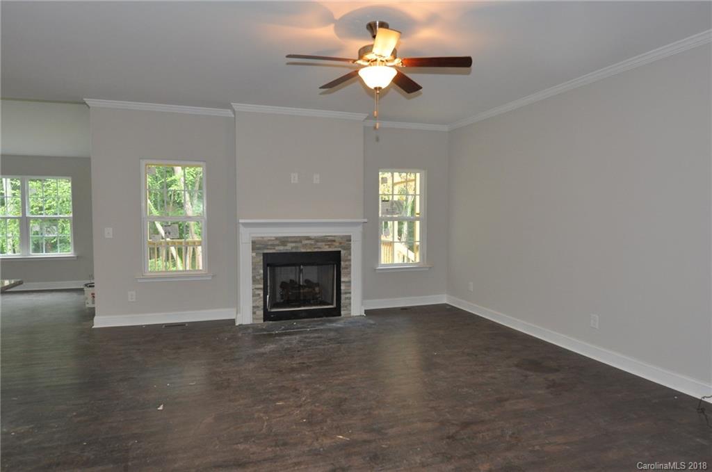 4081 Ruston Creek Road, Unit 83 Catawba, SC 29704 - Photo 3 of 27 an empty room with windows and fireplace