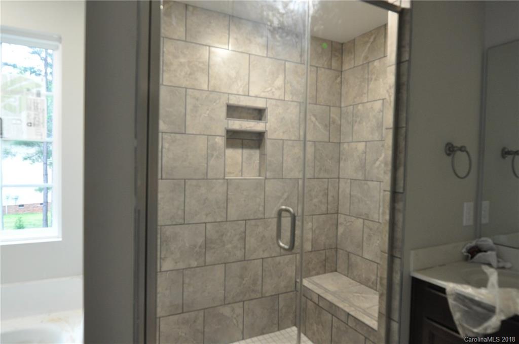 4081 Ruston Creek Road, Unit 83 Catawba, SC 29704 - Photo 23 of 27 a bathroom with a sink and shower