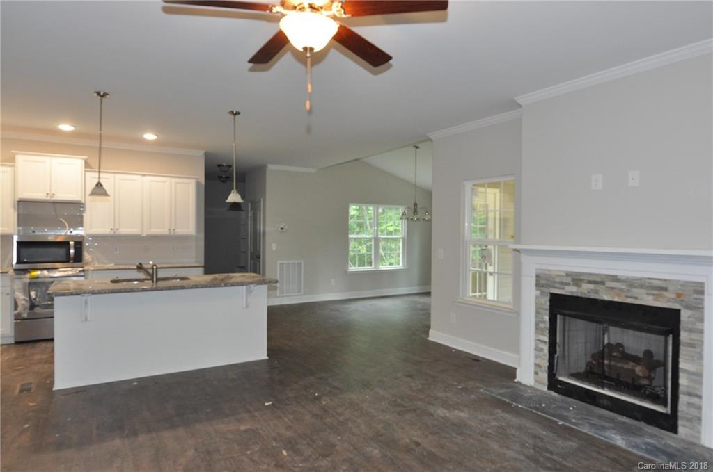 4081 Ruston Creek Road, Unit 83 Catawba, SC 29704 - Photo 5 of 27 a kitchen with kitchen island a sink stainless steel appliances and cabinets