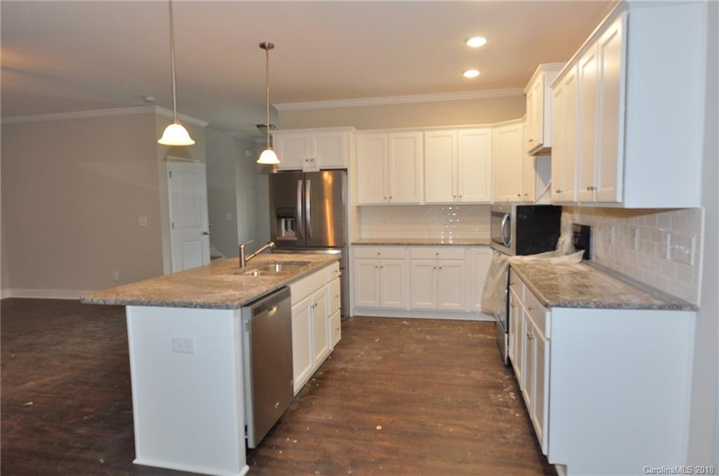 4081 Ruston Creek Road, Unit 83 Catawba, SC 29704 - Photo 7 of 27 a kitchen with a sink stove and refrigerator