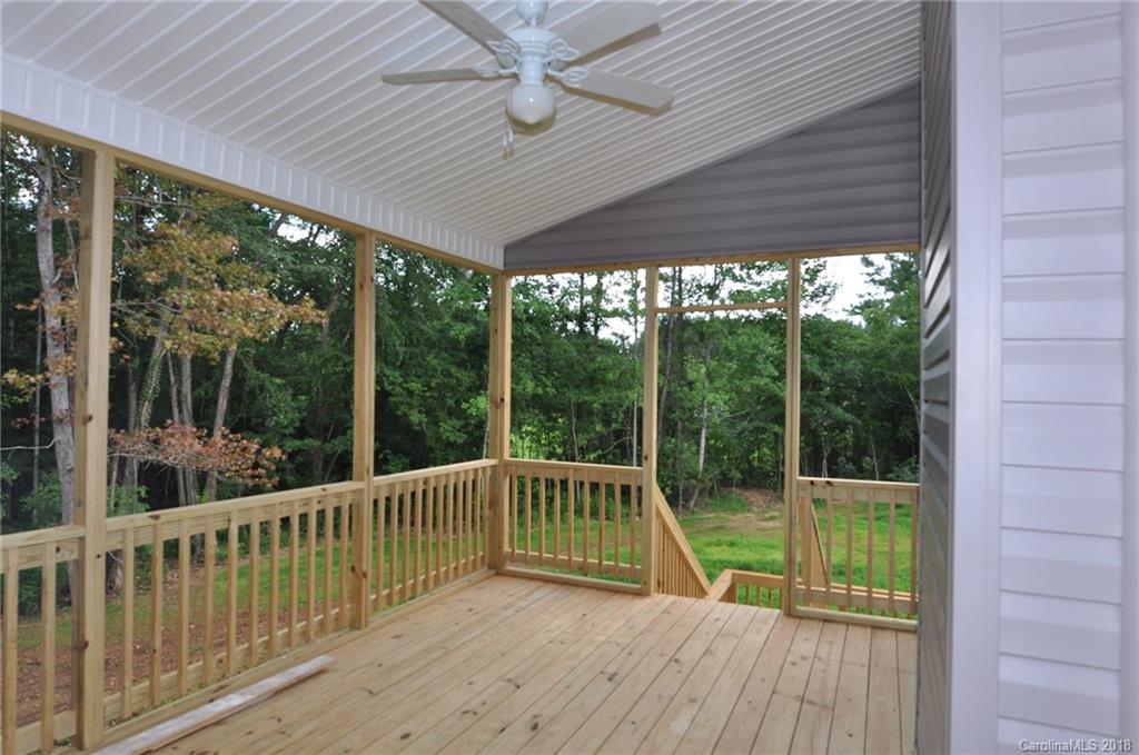 4081 Ruston Creek Road, Unit 83 Catawba, SC 29704 - Photo 10 of 27 a view of a balcony with floor to ceiling windows with wooden floor