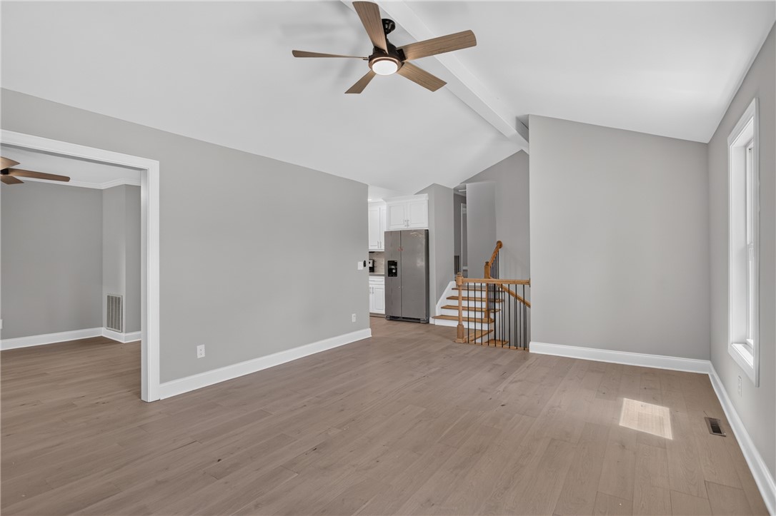 712 Beech Drive Seneca, SC 29678 - Photo 11 of 41 Flowing hardwood floors unite the open-concept living area with a contemporary kitchen.