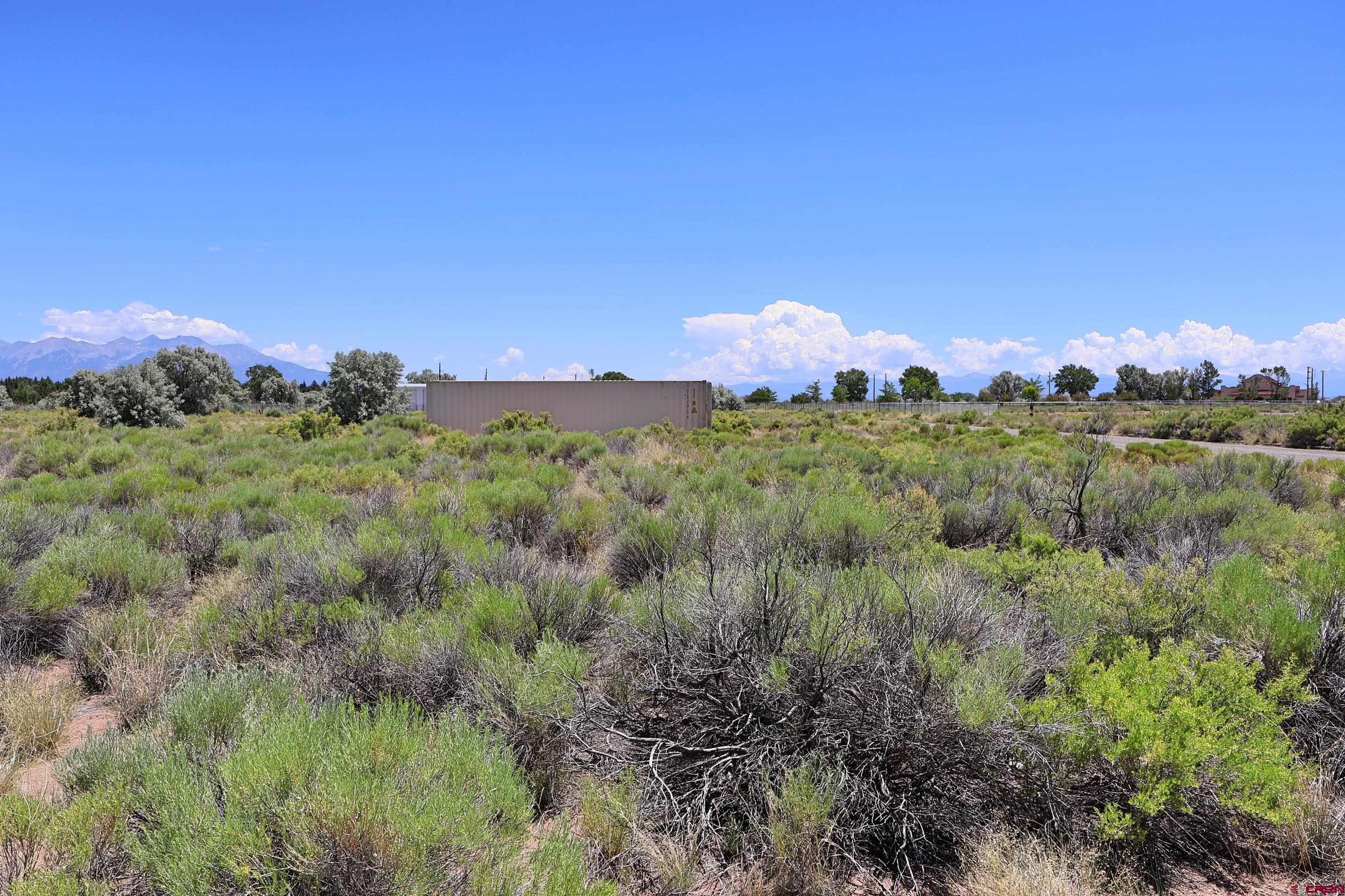 2416 Commerce Circle Alamosa, CO 81101 - Photo 4 of 6 a view of a city with lush green forest