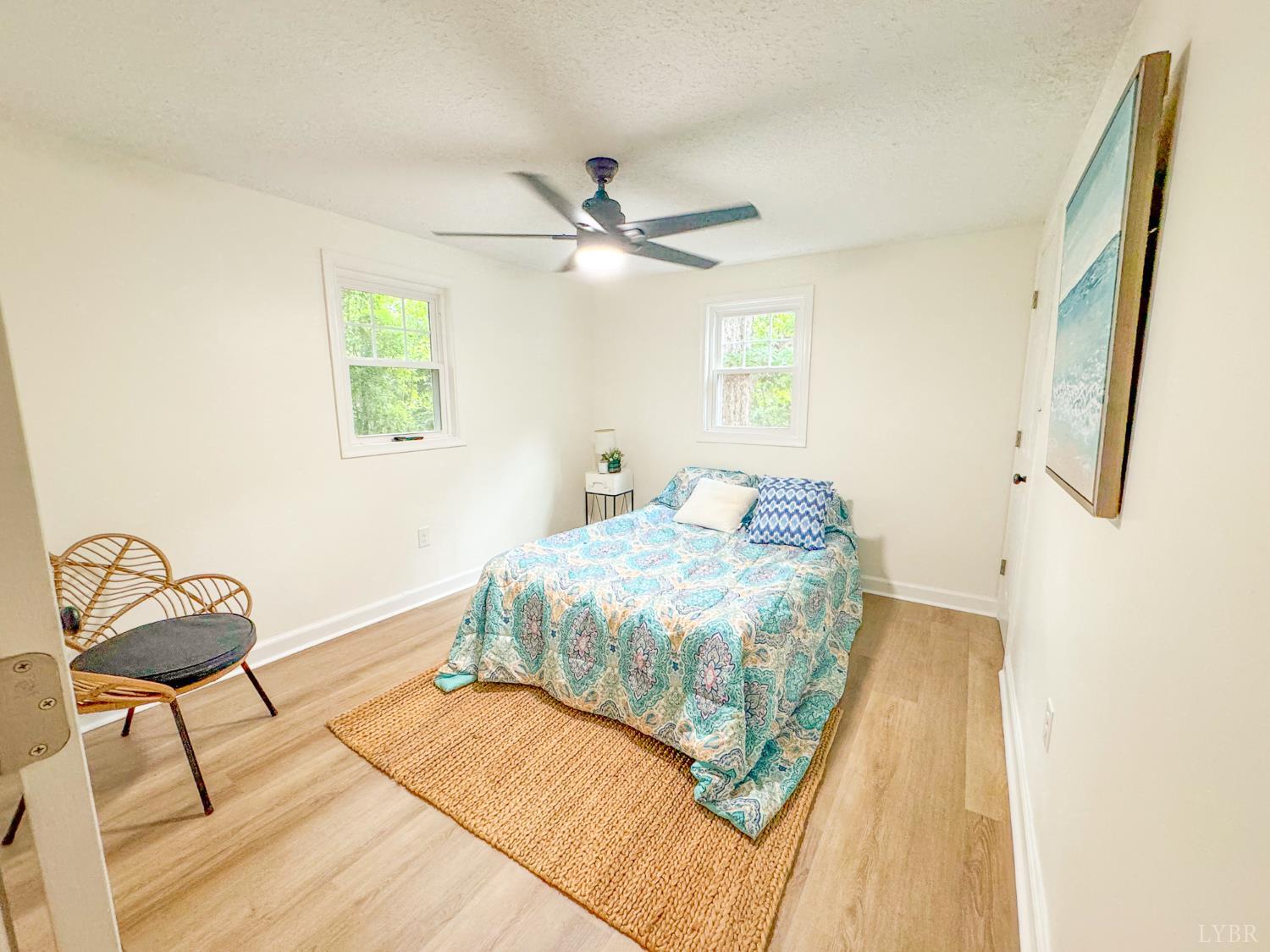 684 East Ferry Road Gladys, VA 24554 - Photo 12 of 20 a bedroom with a bed and a chandelier
