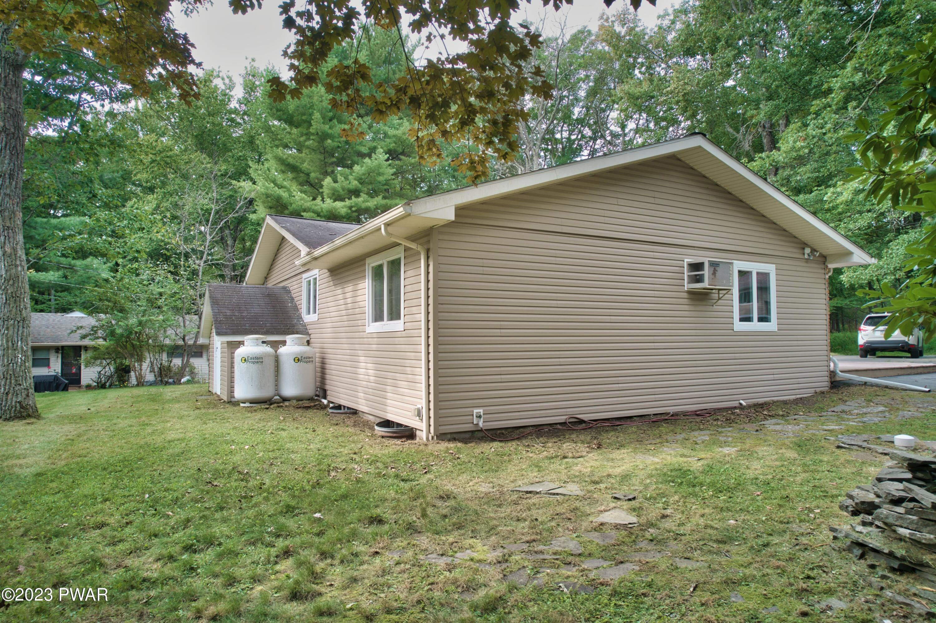 149 Walker Lake Road Shohola, PA 18458 - Photo 46 of 51 a view of a house with a yard
