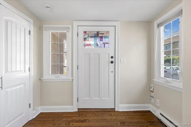 a view of front door with wooden floor