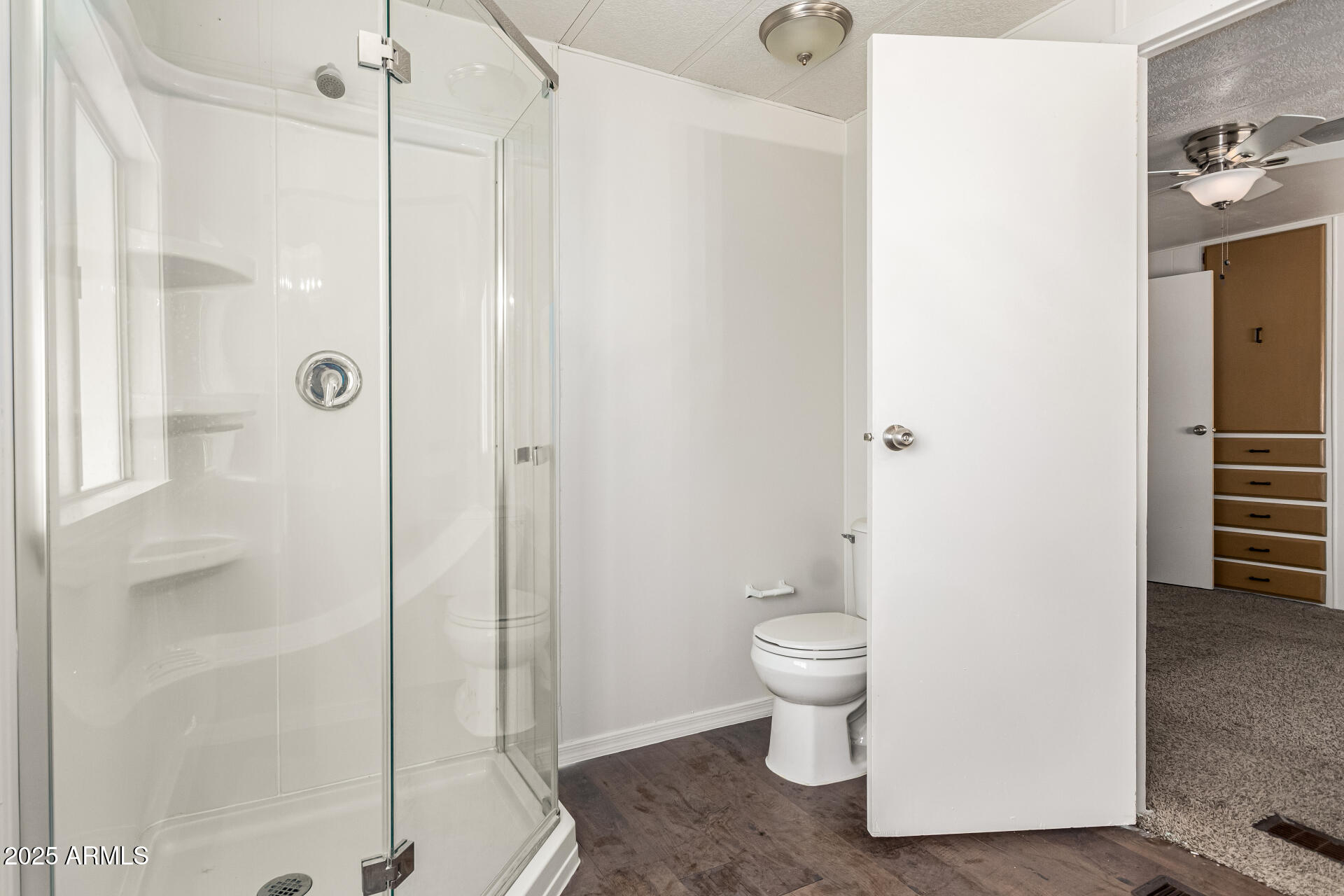 2945 West 9th Place Apache Junction, AZ 85120 - Photo 11 of 23 a bathroom with a toilet and a shower