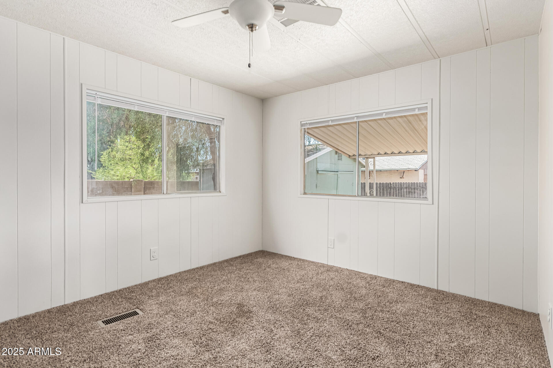 2945 West 9th Place Apache Junction, AZ 85120 - Photo 12 of 23 a view of an empty room with a window