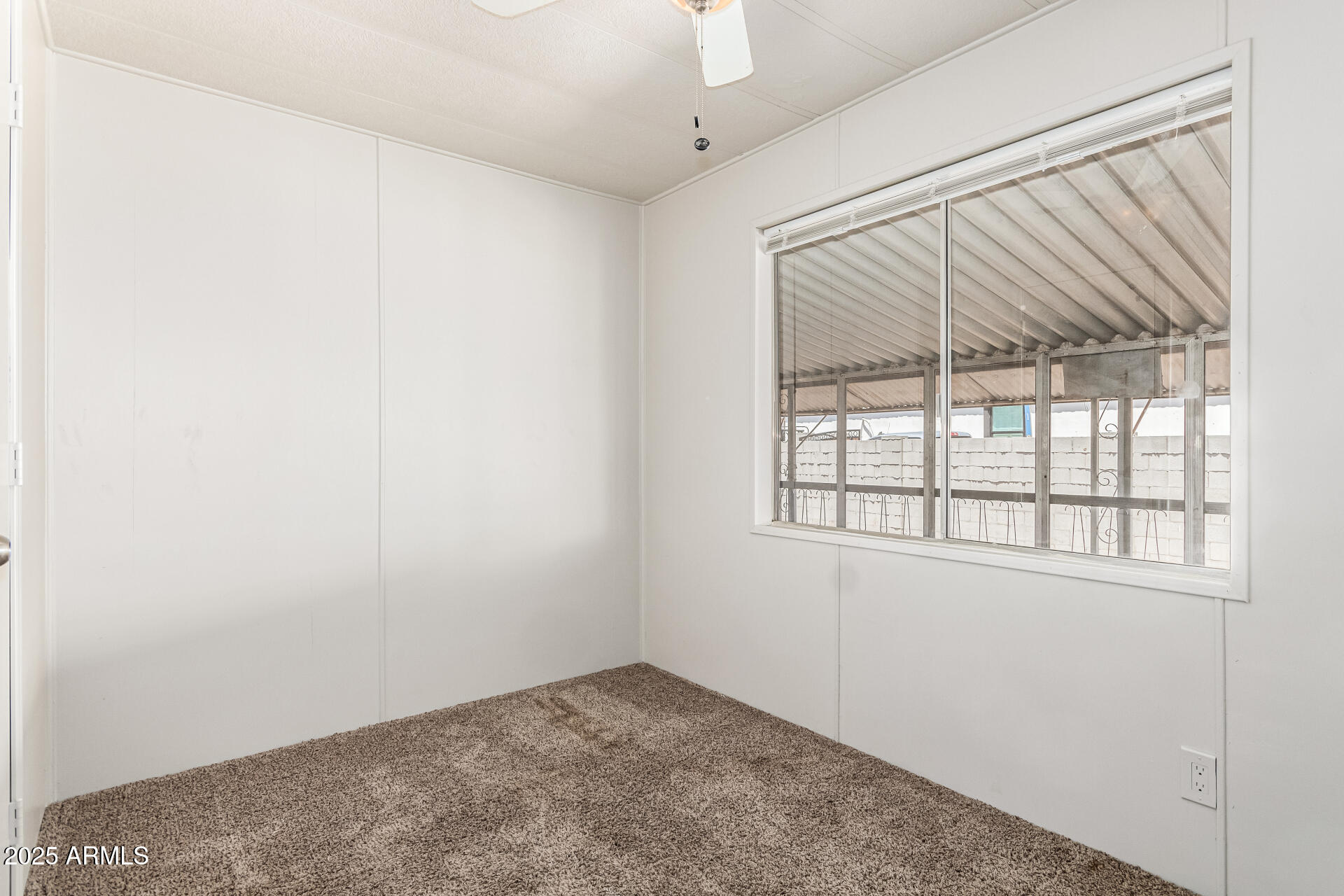2945 West 9th Place Apache Junction, AZ 85120 - Photo 14 of 23 an empty room with a window