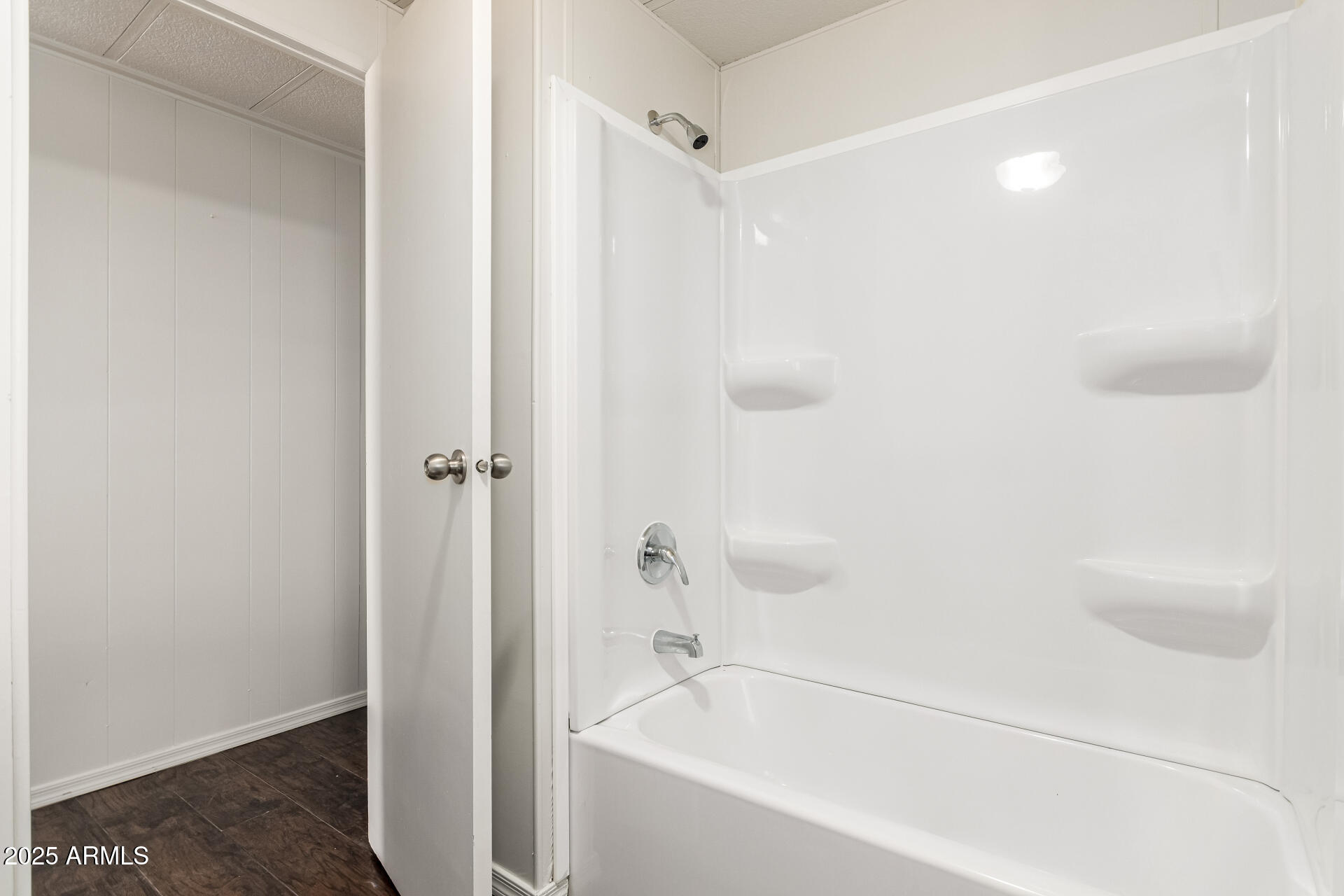 2945 West 9th Place Apache Junction, AZ 85120 - Photo 17 of 23 a white bath tub sitting next to a white sink