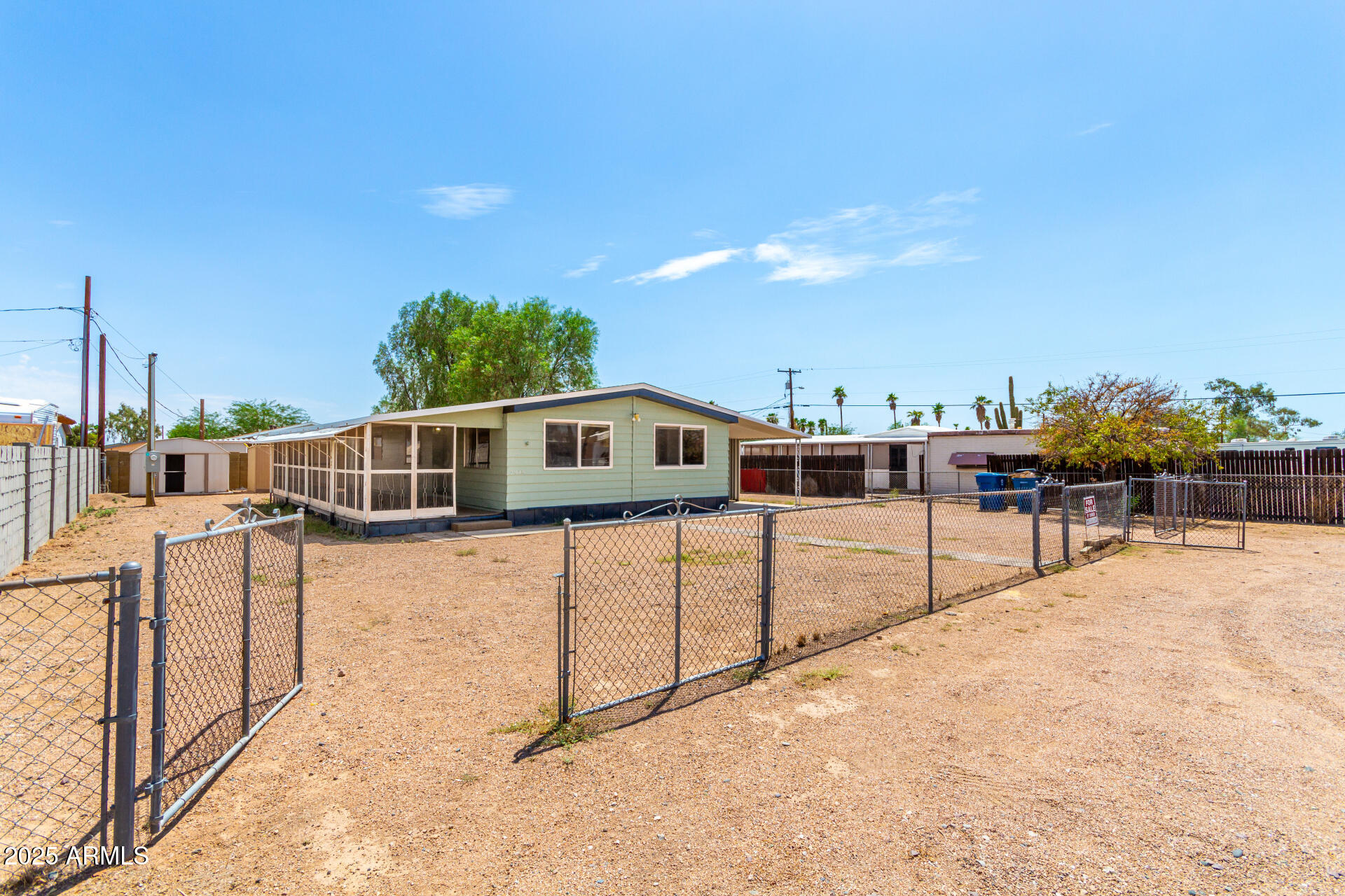 2945 West 9th Place Apache Junction, AZ 85120 - Photo 2 of 23 a view of a terrace with chairs