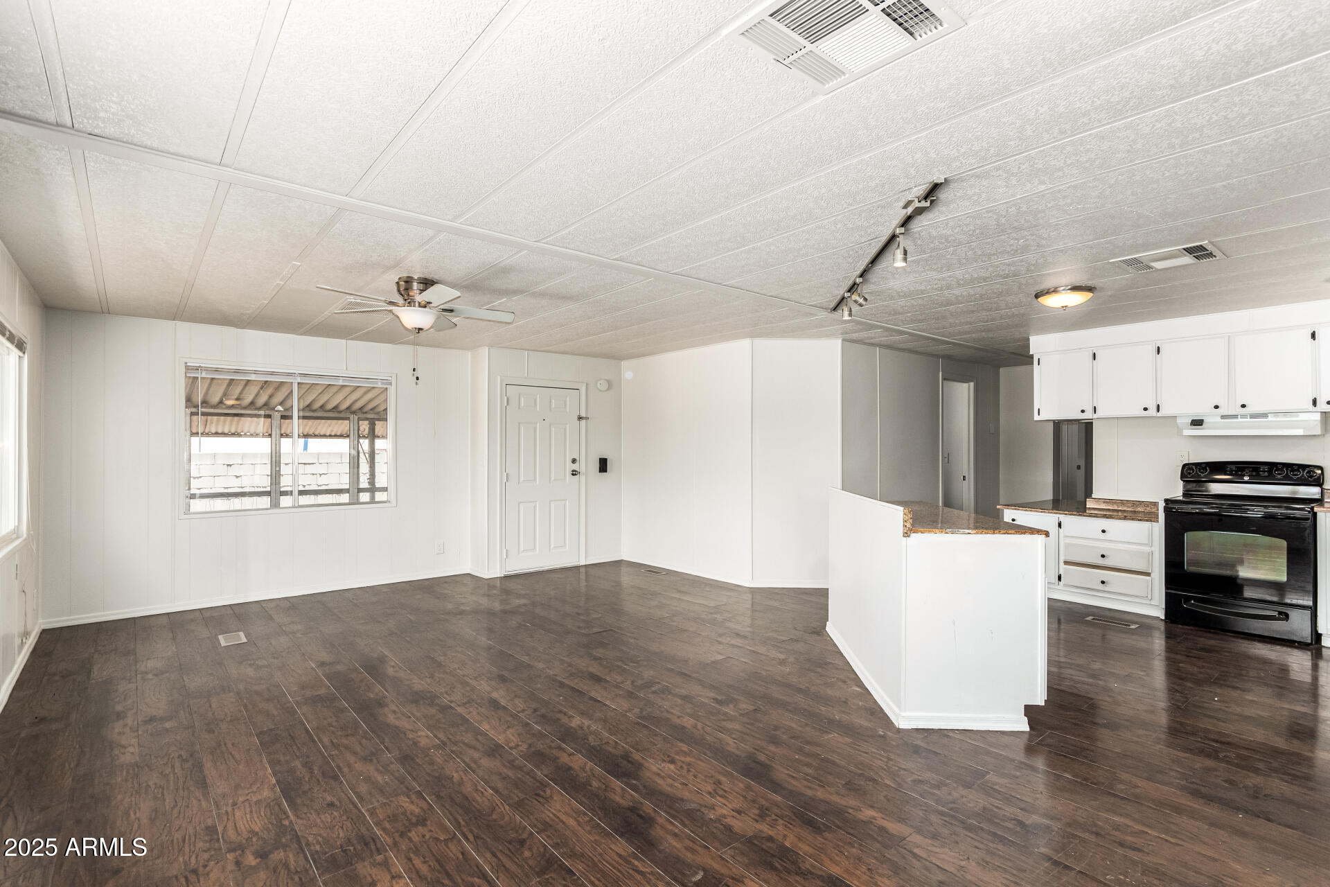 2945 West 9th Place Apache Junction, AZ 85120 - Photo 5 of 23 a view of kitchen with furniture and wooden floor