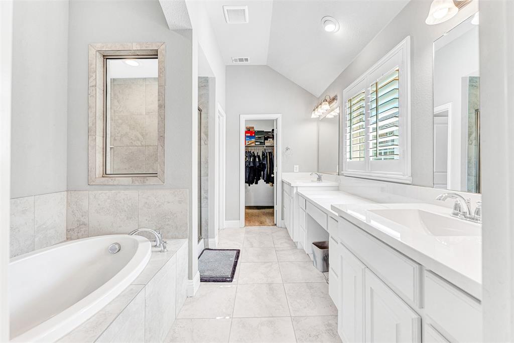 1313 Torrington Lane Forney, TX 75126 - Photo 12 of 21 a spacious bathroom with a tub sink and mirror