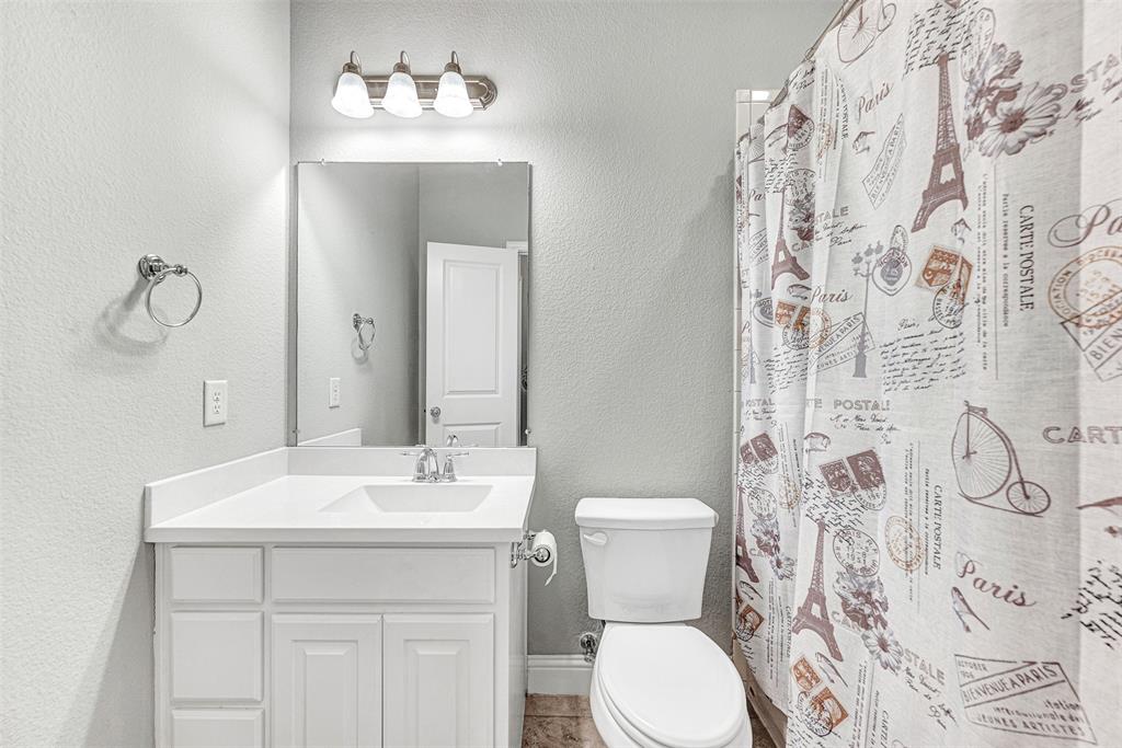 1313 Torrington Lane Forney, TX 75126 - Photo 16 of 21 a bathroom with a sink toilet and shower
