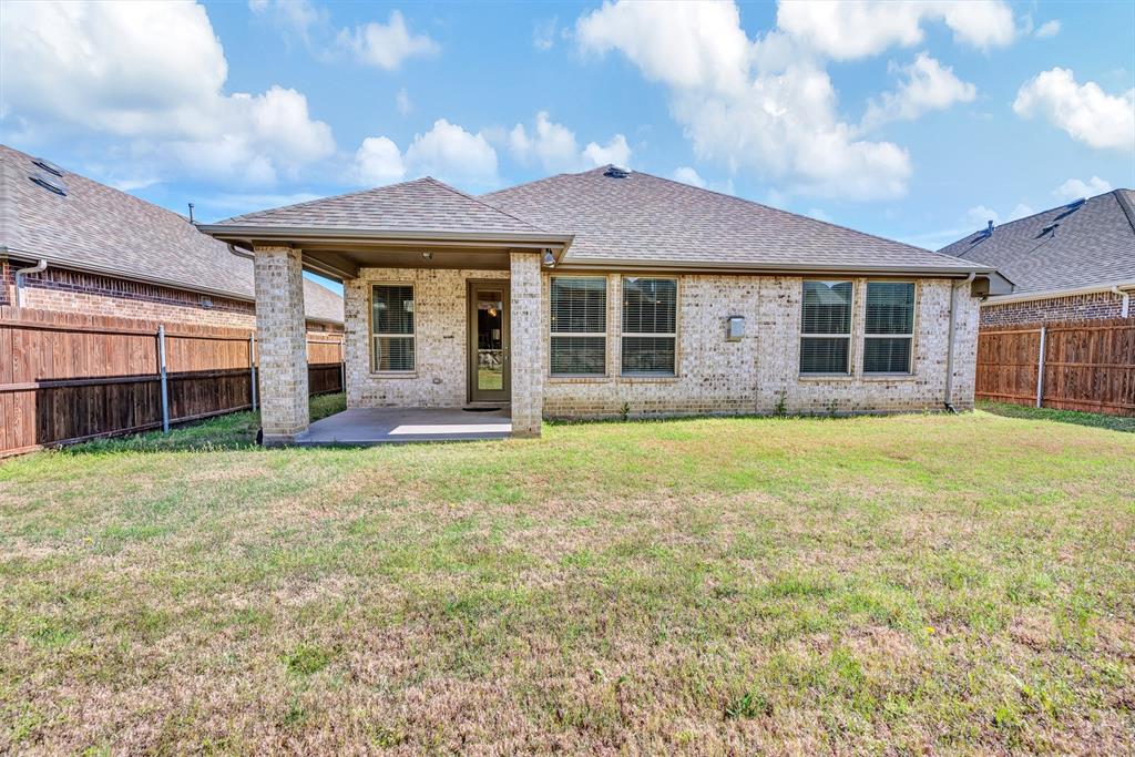 1313 Torrington Lane Forney, TX 75126 - Photo 19 of 21 front view of a house with a yard