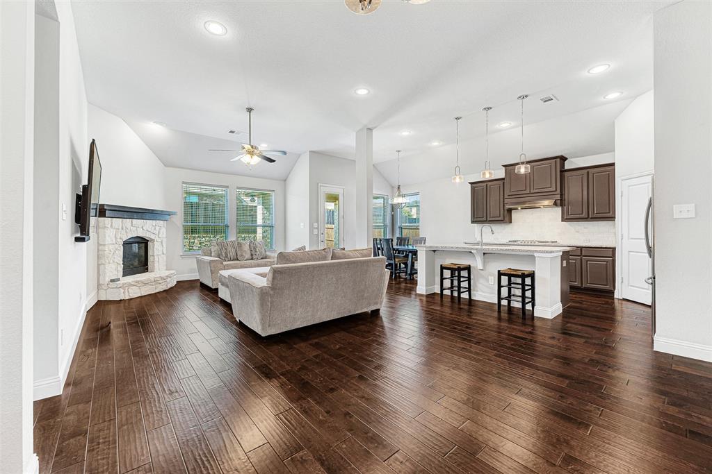 1313 Torrington Lane Forney, TX 75126 - Photo 21 of 21 a living room with furniture and a fireplace