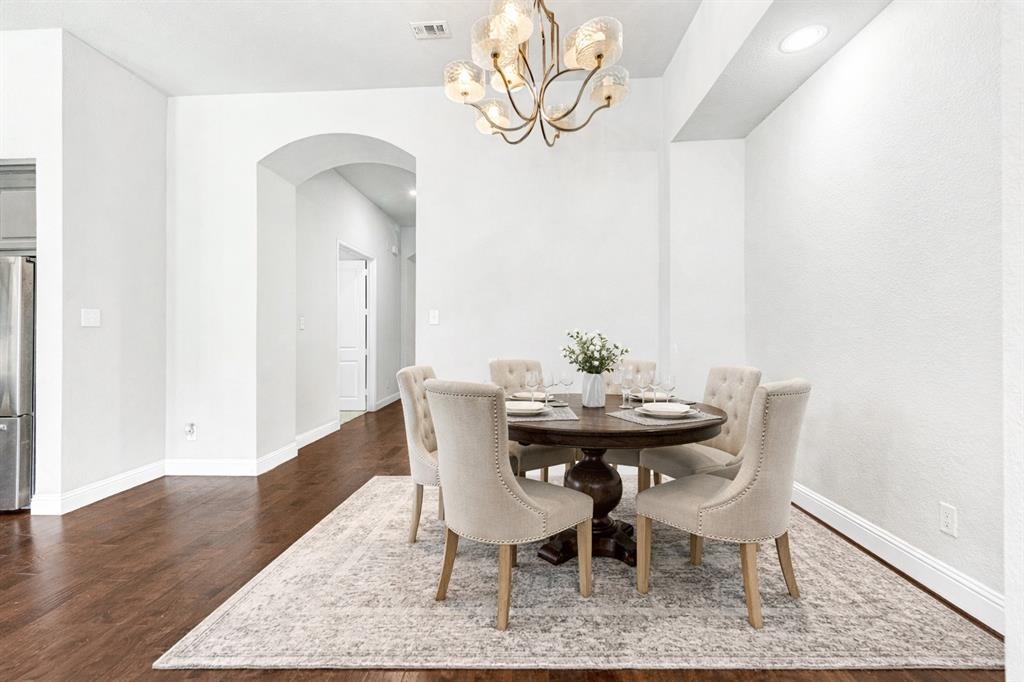 1313 Torrington Lane Forney, TX 75126 - Photo 2 of 21 a view of a dining room with furniture and wooden floor