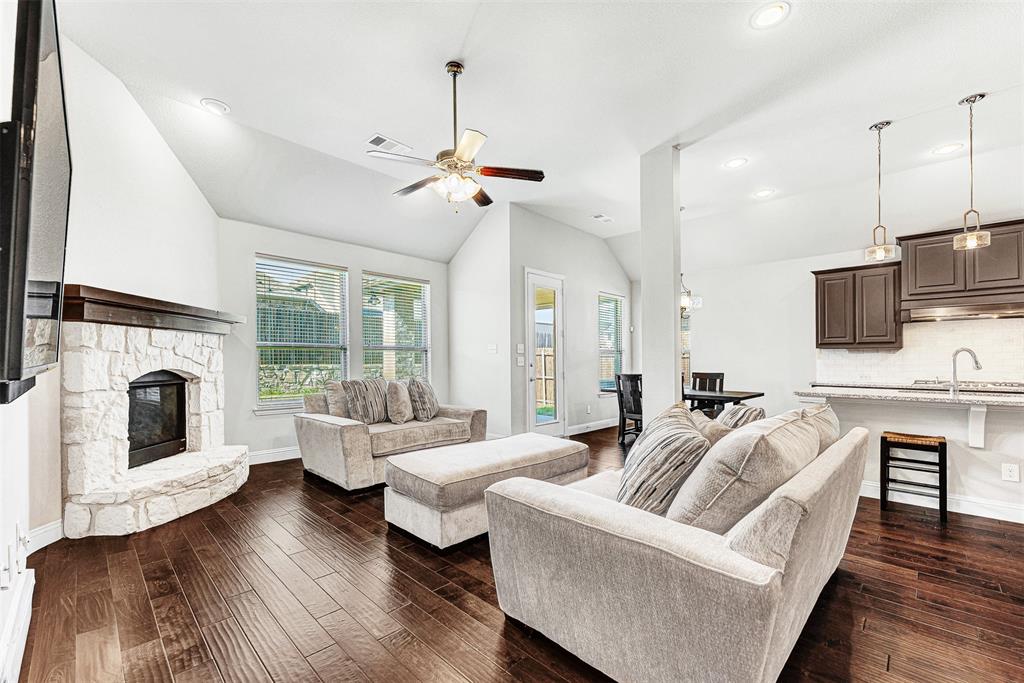 1313 Torrington Lane Forney, TX 75126 - Photo 3 of 21 a living room with furniture fireplace and flat screen tv