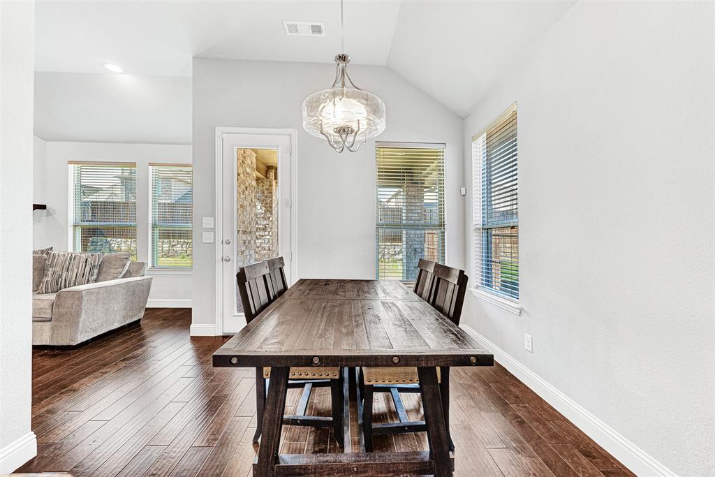 1313 Torrington Lane Forney, TX 75126 - Photo 5 of 21 a view of a dining room with furniture and wooden floor