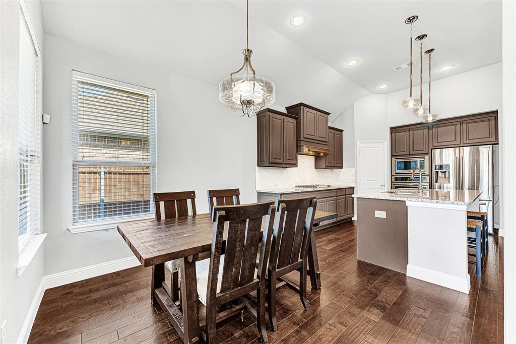 1313 Torrington Lane Forney, TX 75126 - Photo 8 of 21 a view of a dining room with furniture window and wooden floor